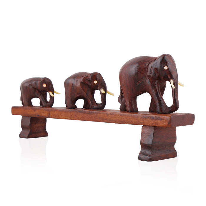 Handcrafted Rosewood Sculpture – Three Elephants Crossing a Bridge