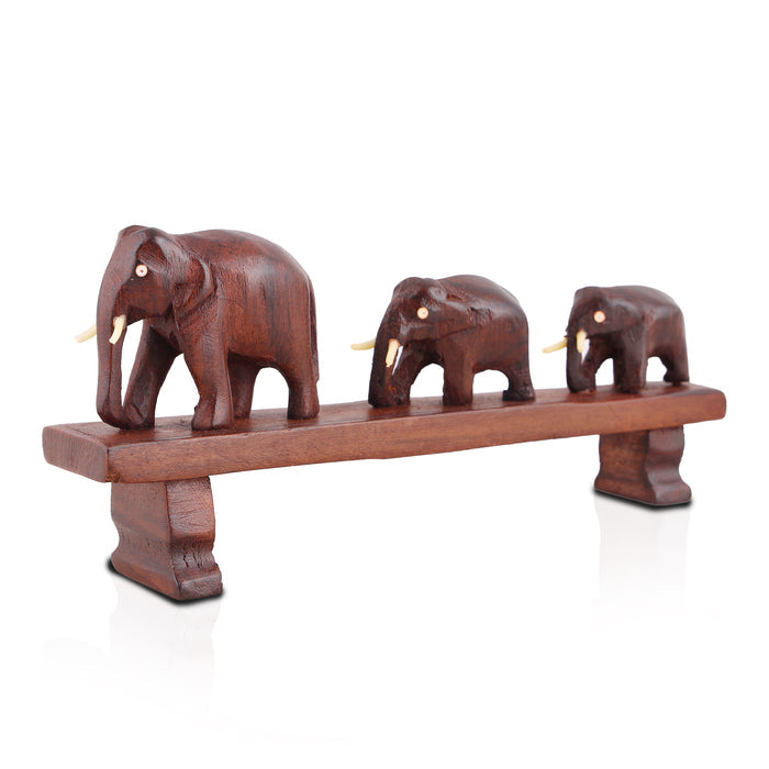 Handcrafted Rosewood Sculpture – Three Elephants Crossing a Bridge