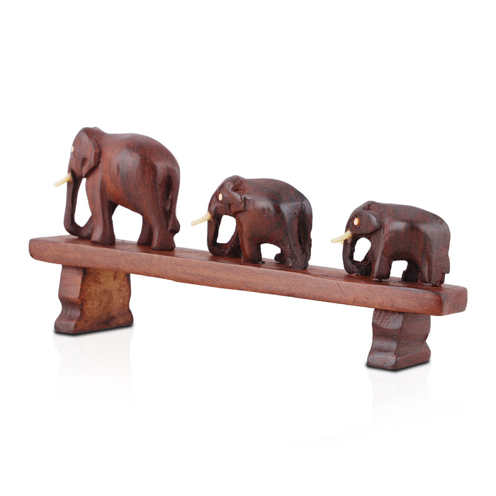 Handcrafted Rosewood Sculpture – Three Elephants Crossing a Bridge